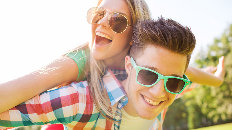 smiling couple having fun in park